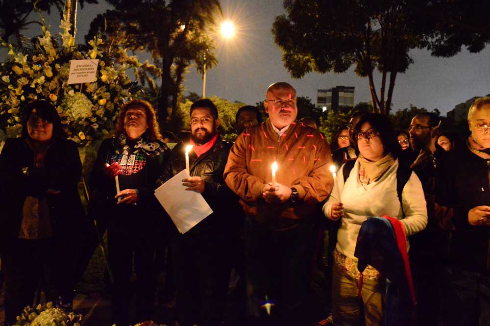 People holding candles after the killing an LGBTI person
