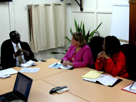 Commissioners Dinah Shelton and Tracy Robinson in a meeting with Stanley Betterson, Minister of Regional Development of Suriname.